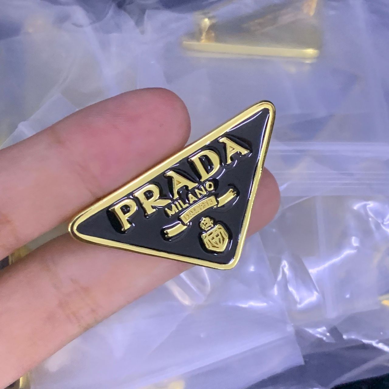 Prada Brooch Original mirror-finish stainless steel (stamped/branded)