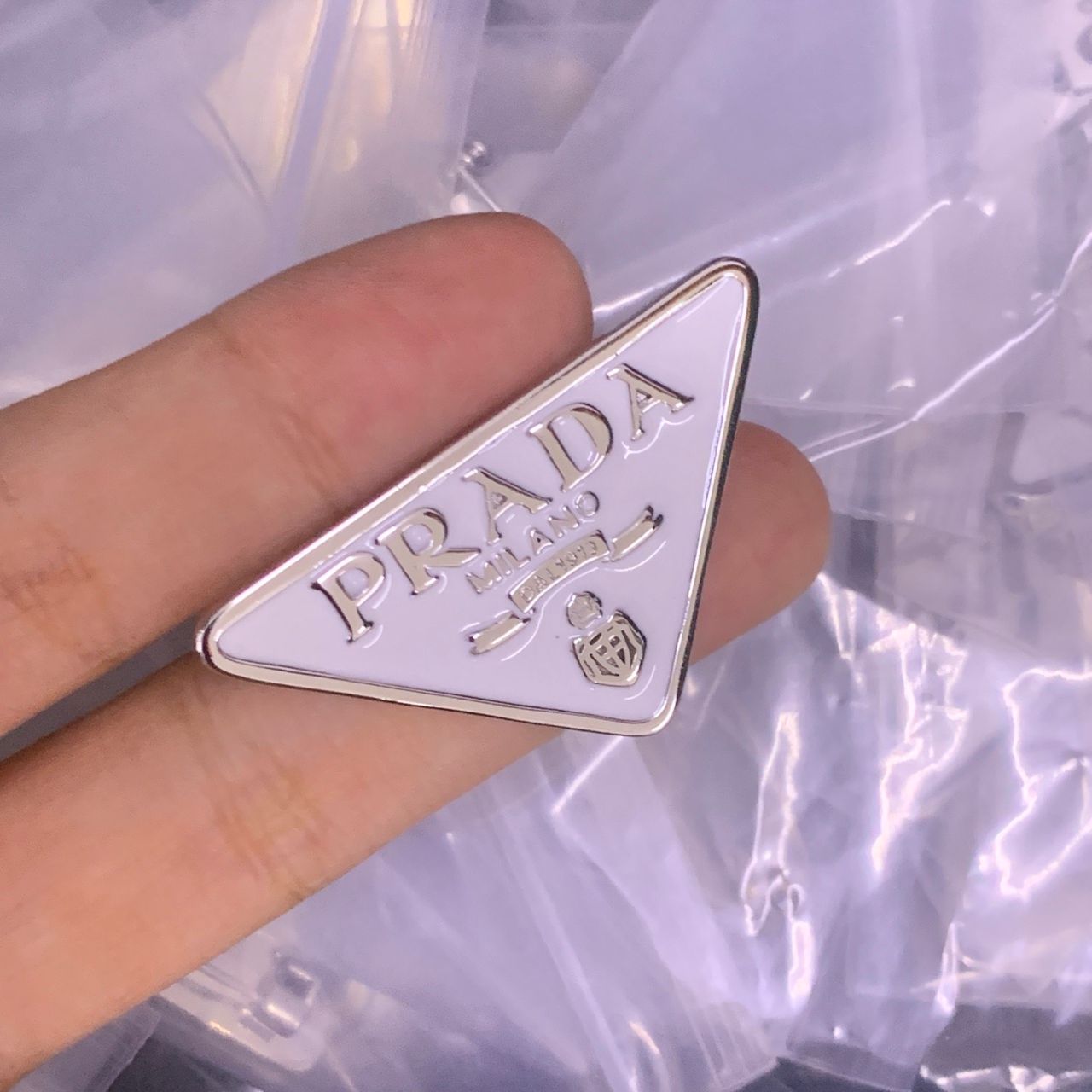 Prada Brooch Original mirror-finish stainless steel (stamped/branded)